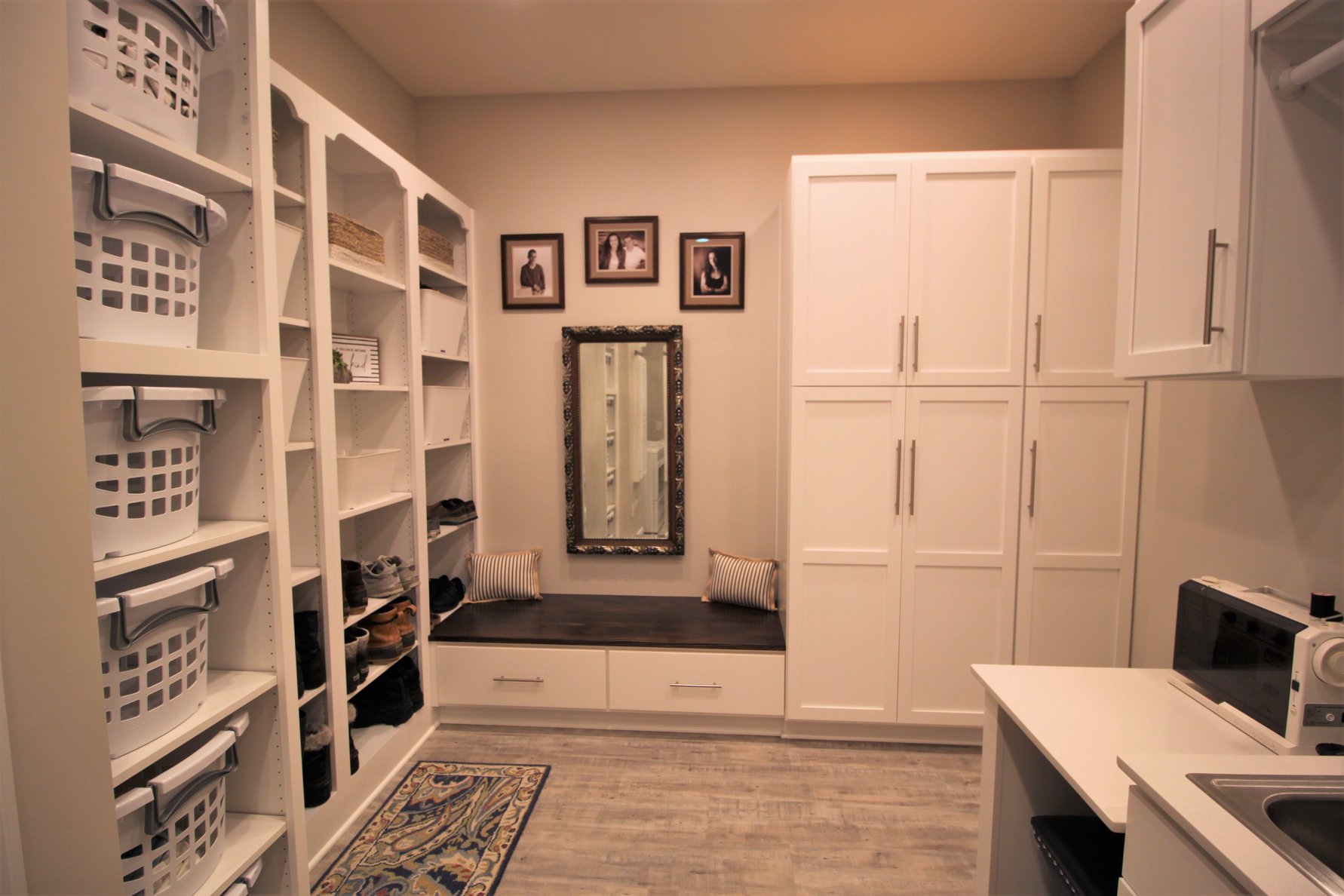 laundry room with multiple storage