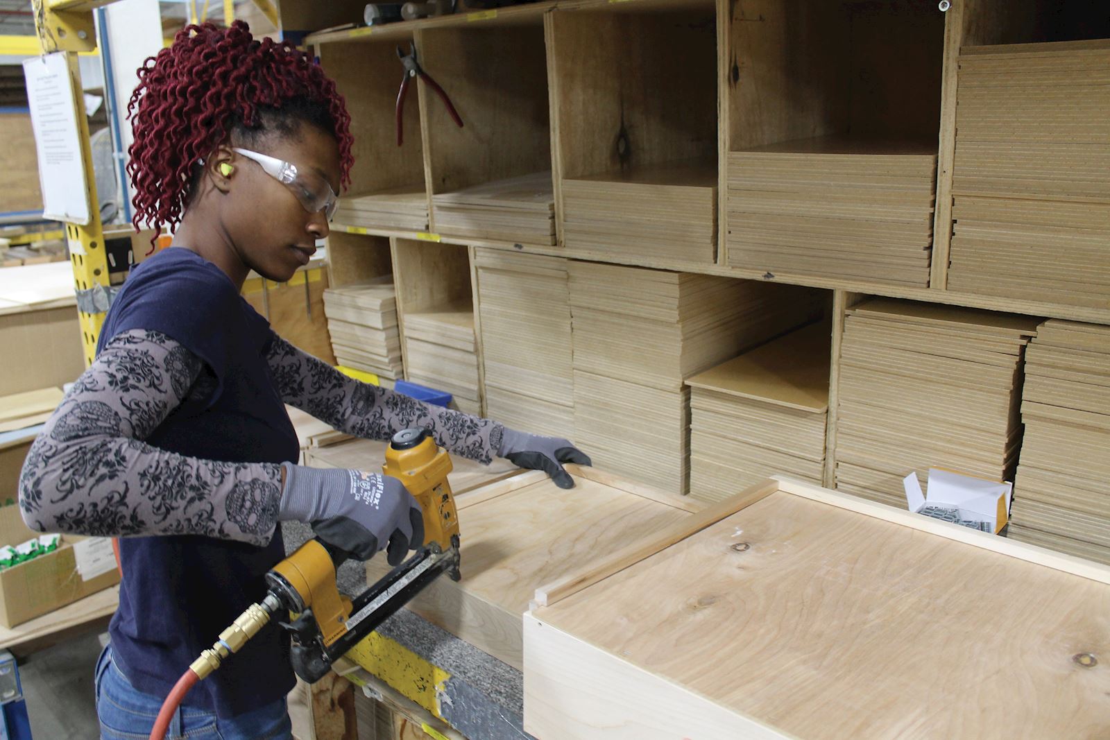 american manufacturer drilling into a cabinet